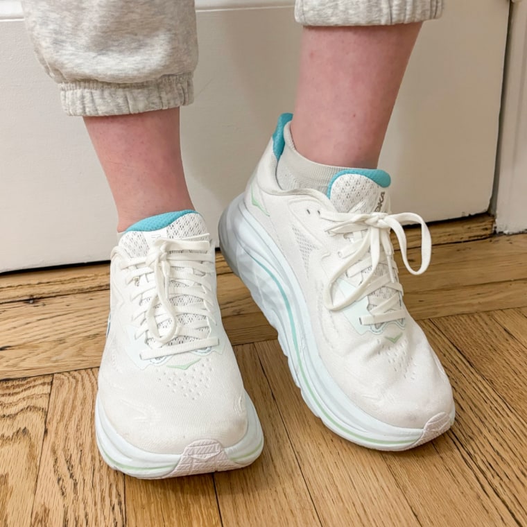 I wore the Hoka Clifton 9 sneakers during five-mile walks on pavement and trails.