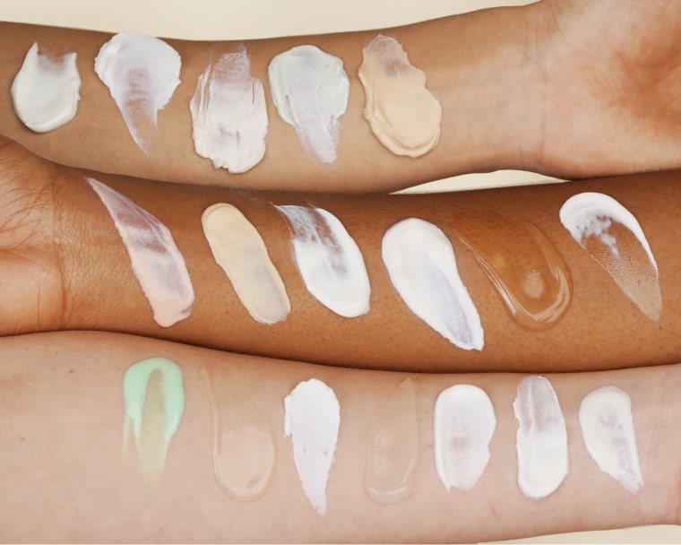 3 arms swatched with different sunscreen textures
