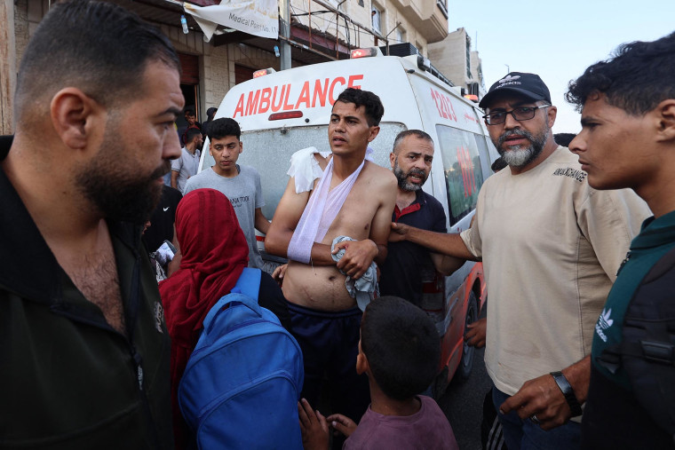 First responders arrive in an ambulance to evacuate the injured near an aid distribution point not far from the Netzarim checkpoint in Gaza on June 1, 2025.