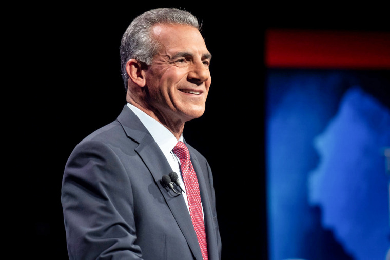Jack Ciattarelli smiles while standing onstage
