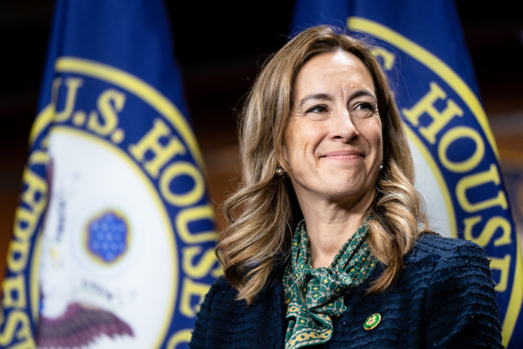 Mikie Sherrill smiles while standing on stage