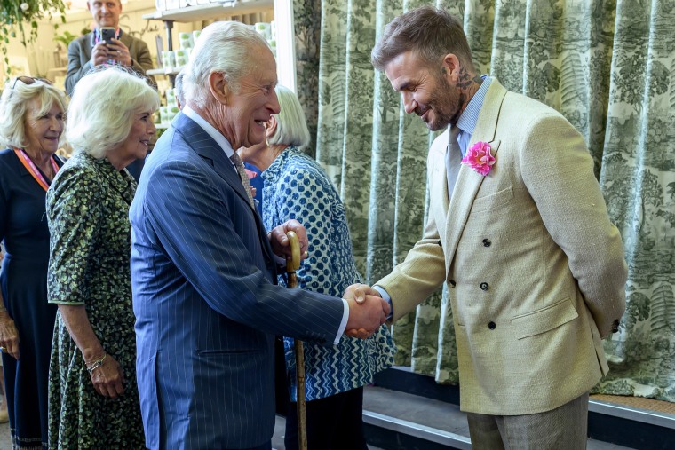 David Beckham speaks with King Charles III at the Chelsea Flower Show on May 20, 2025 in London, England. 