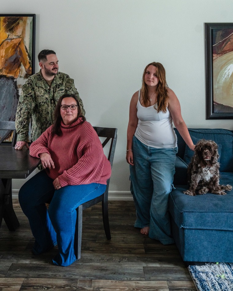 William and Aislyn Maupin with their daughter Teagan Jenkins, 14, in their temporary home.