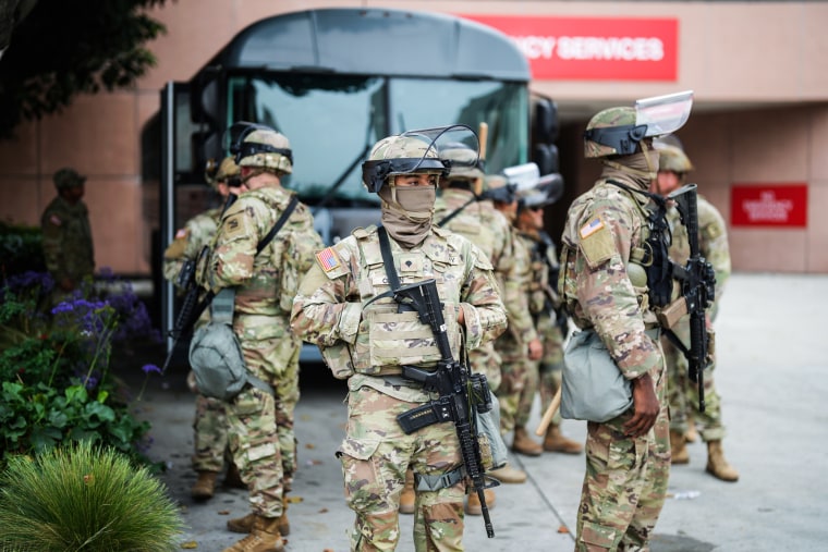 National Guard stand outside