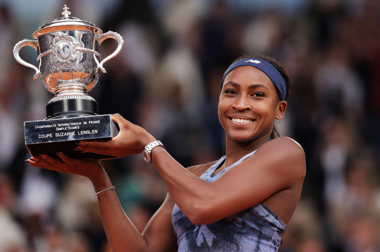 Coco Gauff holds her trophy