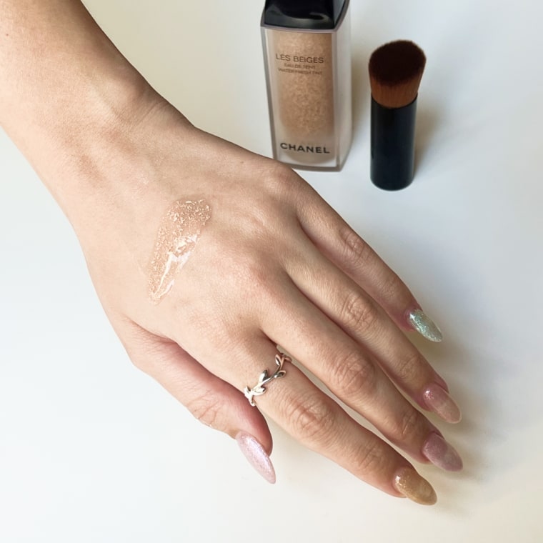 Swatch of the Chanel foundation on back of woman’s hand