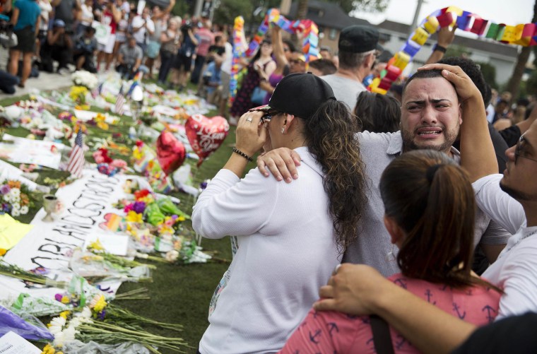Jose Hernandez, right, mourns the loss of his friends Amanda Alvear and Mercedez Flores who were killed in the mass shooting at the Pulse nightclub, in 2016.