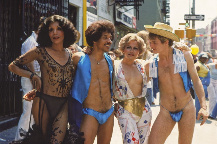Four revelers at the Gay Liberation Parade, also known as the Christopher Street Liberation Day March, in New York City in 1976.