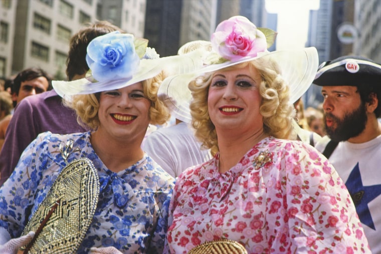 Two participants dressed up for the Gay Liberation Parade on the Avenue of the Americas in New York City in 1975.