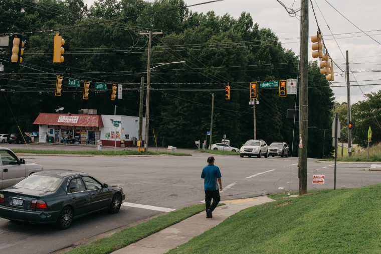 Food Lion worker crosses West Hudson Blvd near where Legend Jenkins was struck by a car 