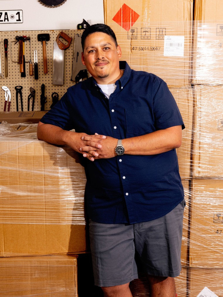 Anthony Mendoza with his new shipment of Chrono Cleans in his garage.