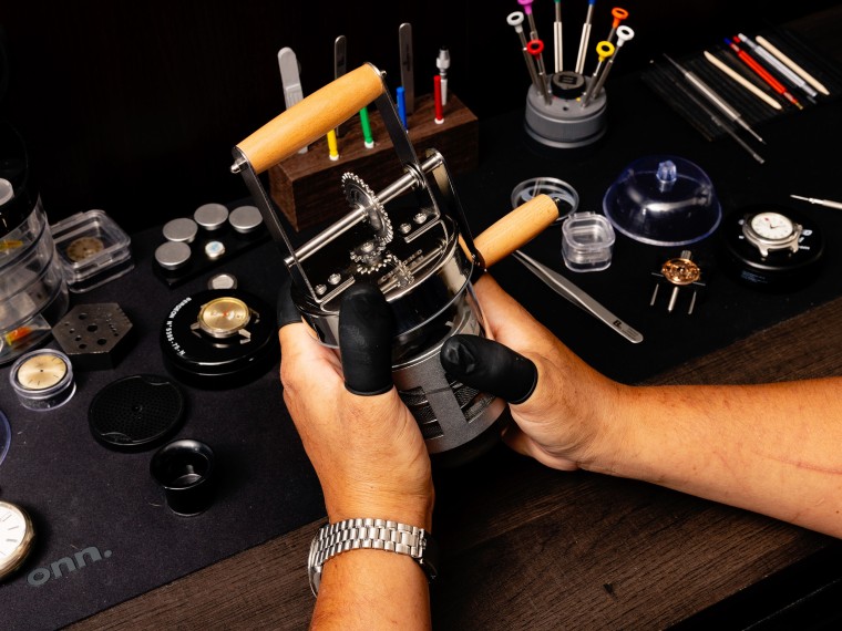 Mendoza using the Chrono Clean in his closet workshop.