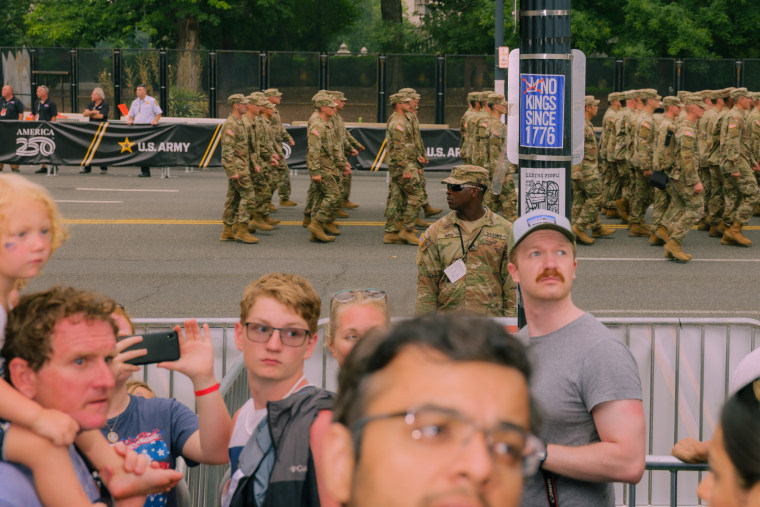 Parade-goers and Army personnel.
