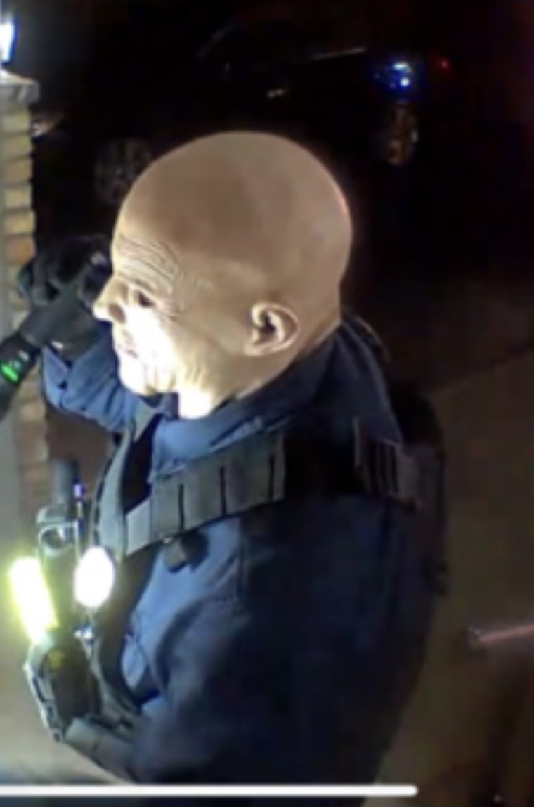 A man knocking on a door in security camera footage.