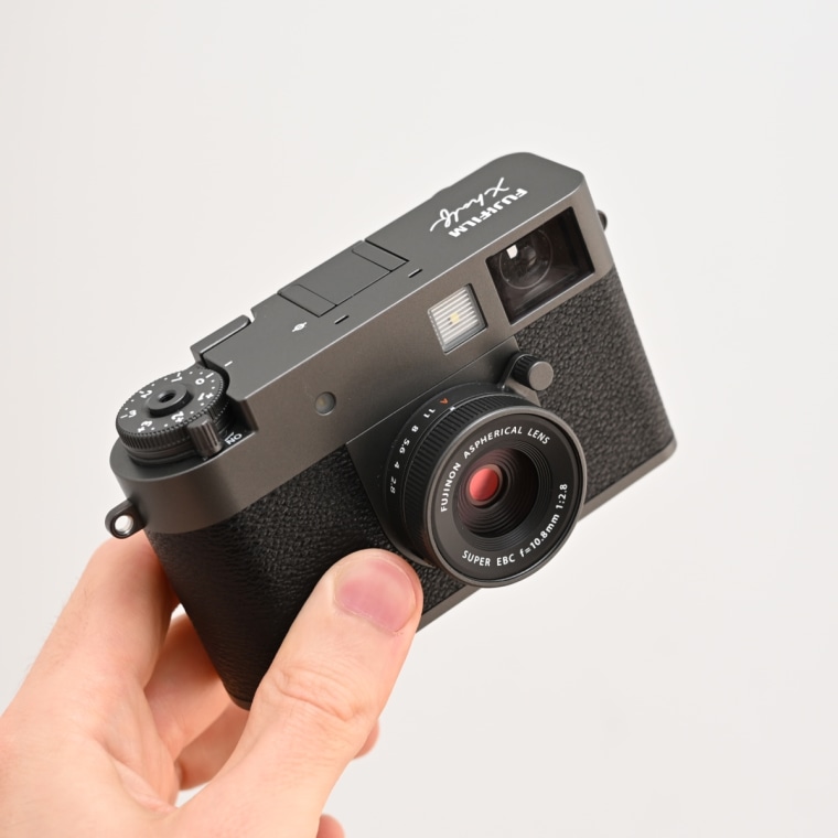 A close up of the Fujifilm X Half camera in the hand of NBC Reporter Harry Rabinowitz.