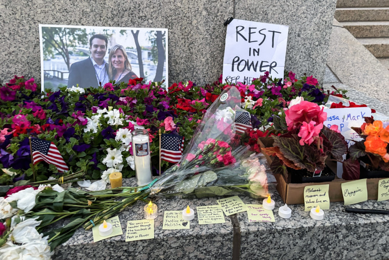 Flowers and notes are left for Melissa Hortman outside