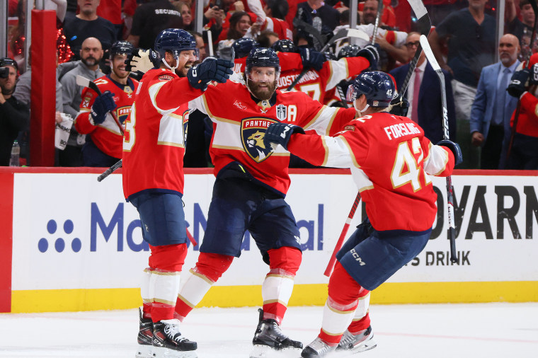Image: 2025 Stanley Cup Final - Game Six Sam Reinhart #13 of the Florida Panthers celebrates with Carter Verhaeghe #23 and Gustav Forsling