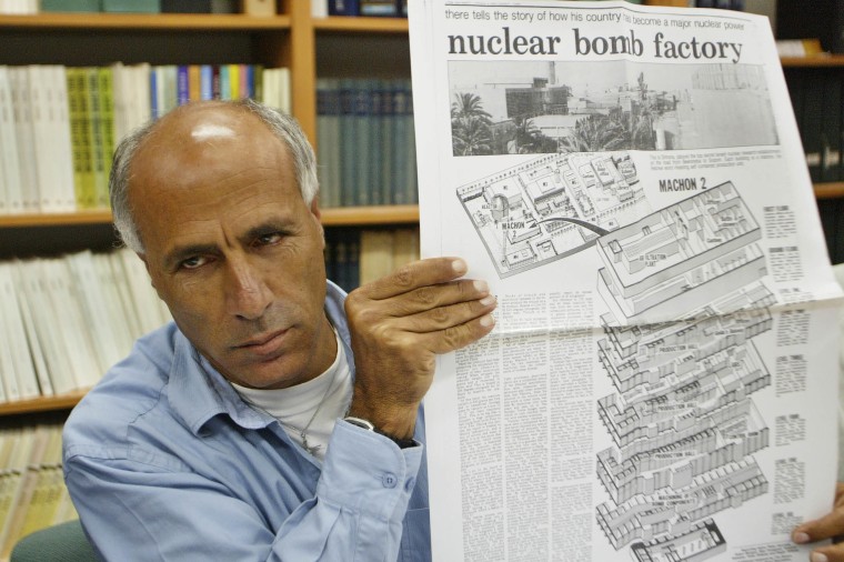 Former nuclear technician Mordechai Vanunu holds a copy of the original newspaper in which he revealed Israel's nuclear secrets in Jerusalem in 2004.
