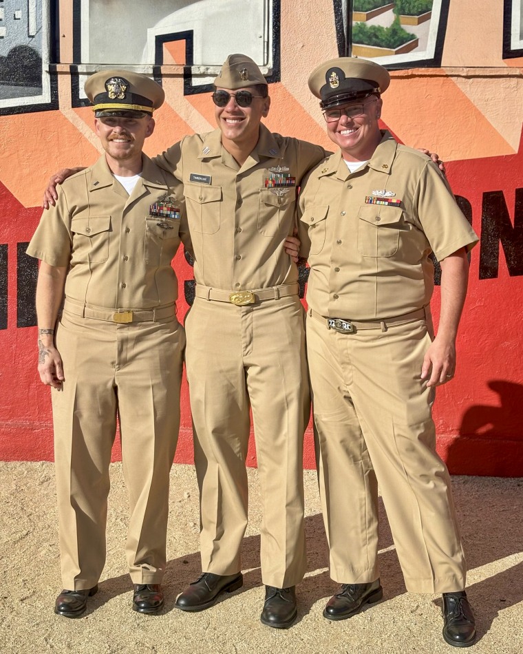 Lt. Junior Grade Sam Rodriguez, left with Parker Moore, an electronics technician in nuclear power, center, and Lt. Rae Timberlake, right. All three of them are trans and nonbinary service members in the Navy.