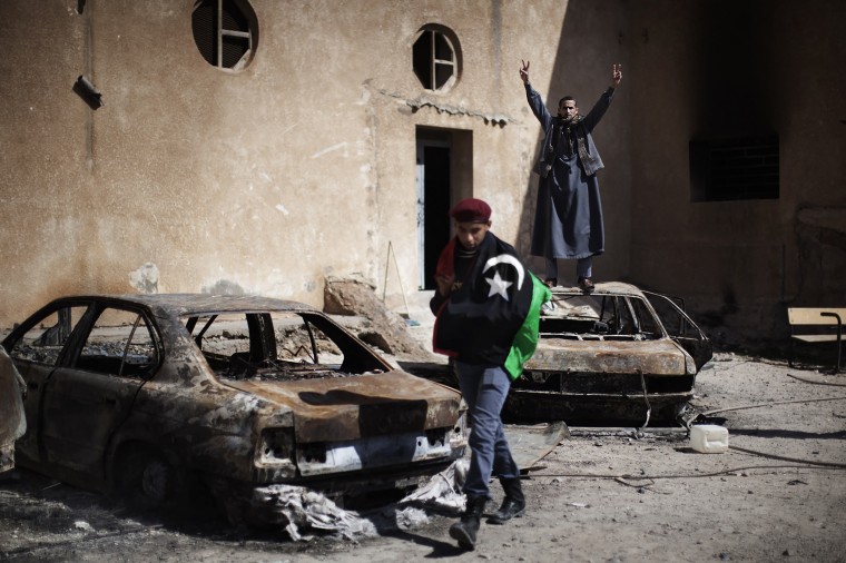 Libya was on edge as forces loyal to Kadhafi's crumbling regime staged a bloody fightback in western towns near Tripoli and the east declared itself free of his iron-fisted rule.