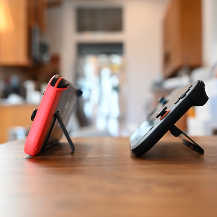 A side-by-side, in-profile image of the original Nintendo Switch and the Nintendo Switch 2, showing the difference between the built-in kickstands.