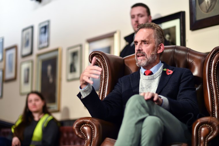 Jordan Peterson speaks while seated