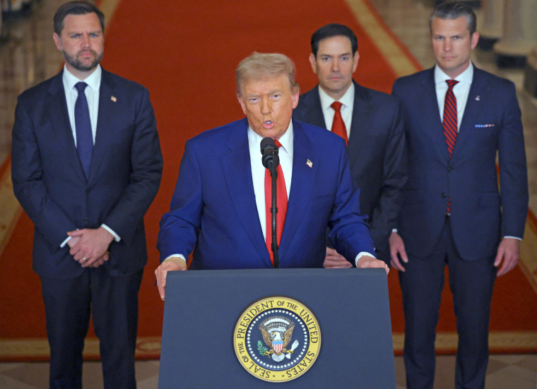 Trump addresses the nation from a lectern at the White House.