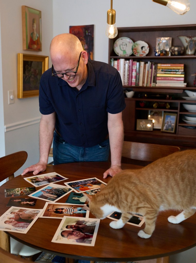 Jim Obergefell with photographs of his precocious husband, John Arthur.
