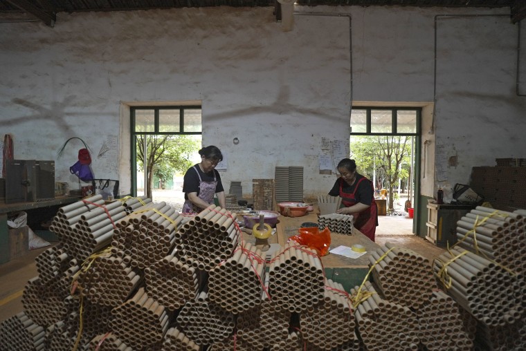Workers making fireworks at a factory in Liuyang, China.