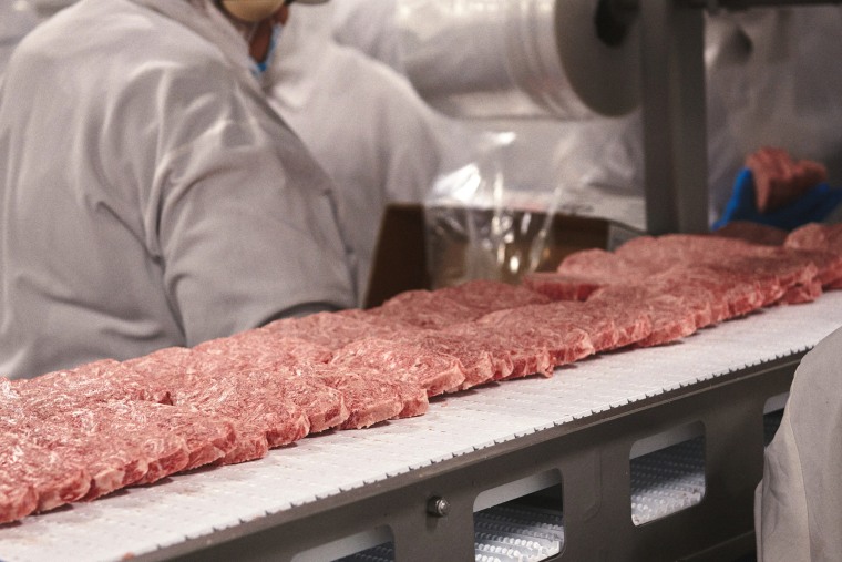 Workers at the Glenn Valley Foods facility on June 13.