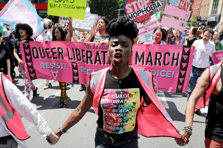 People participate in the Queer Liberation March