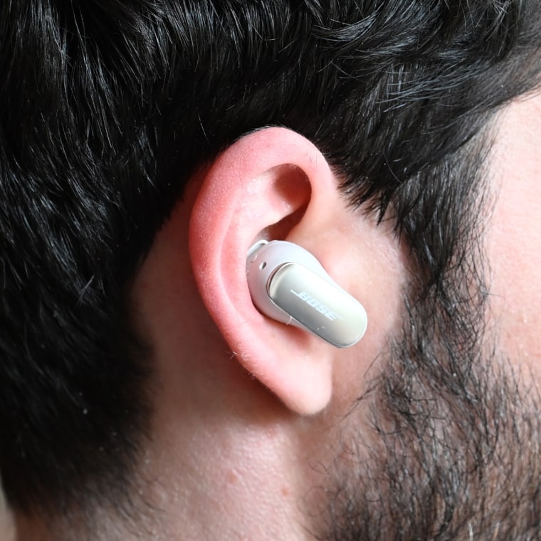 A close up of a Bose Quiet Comfort Ultra earbud in the ear of the writer.
