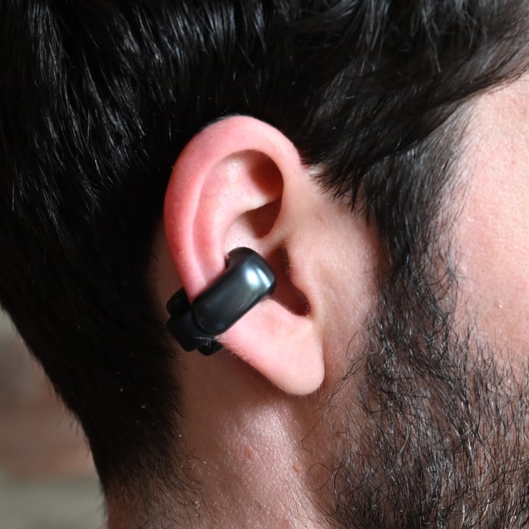A close up of a Bose Ultra Open earbud in the ear of the writer.
