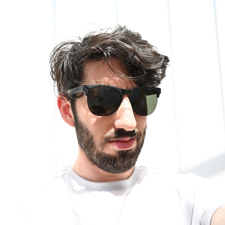 A headshot of NBC Select reporter Harry Rabinowitz wearing the Goodr Avant G sunglasses.