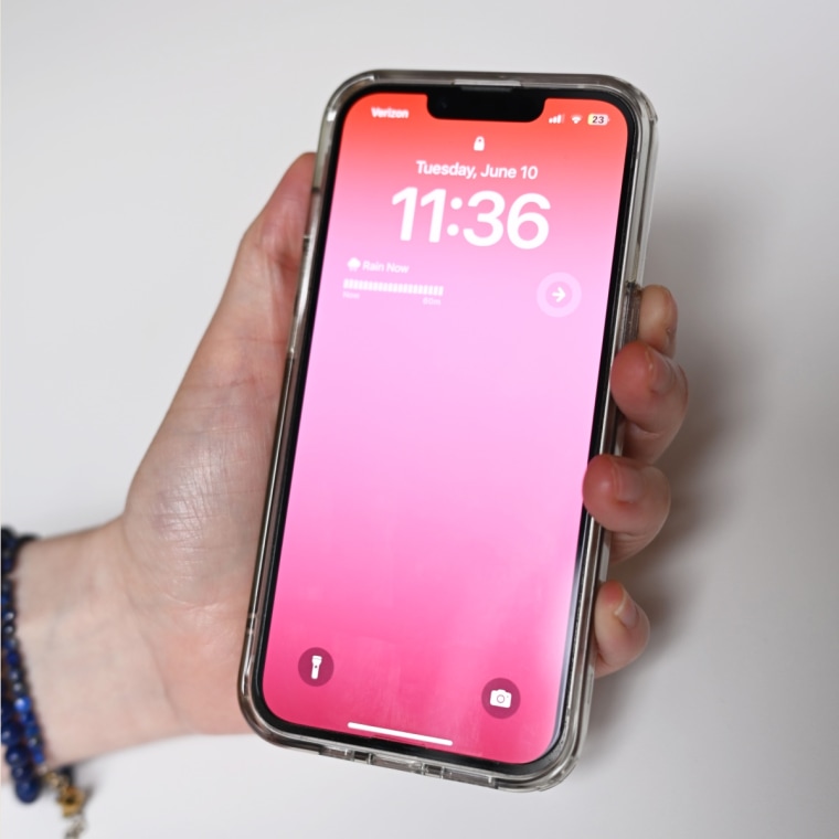 A close up of an iPhone with a Zagg XTR4 screen protector applied over it.