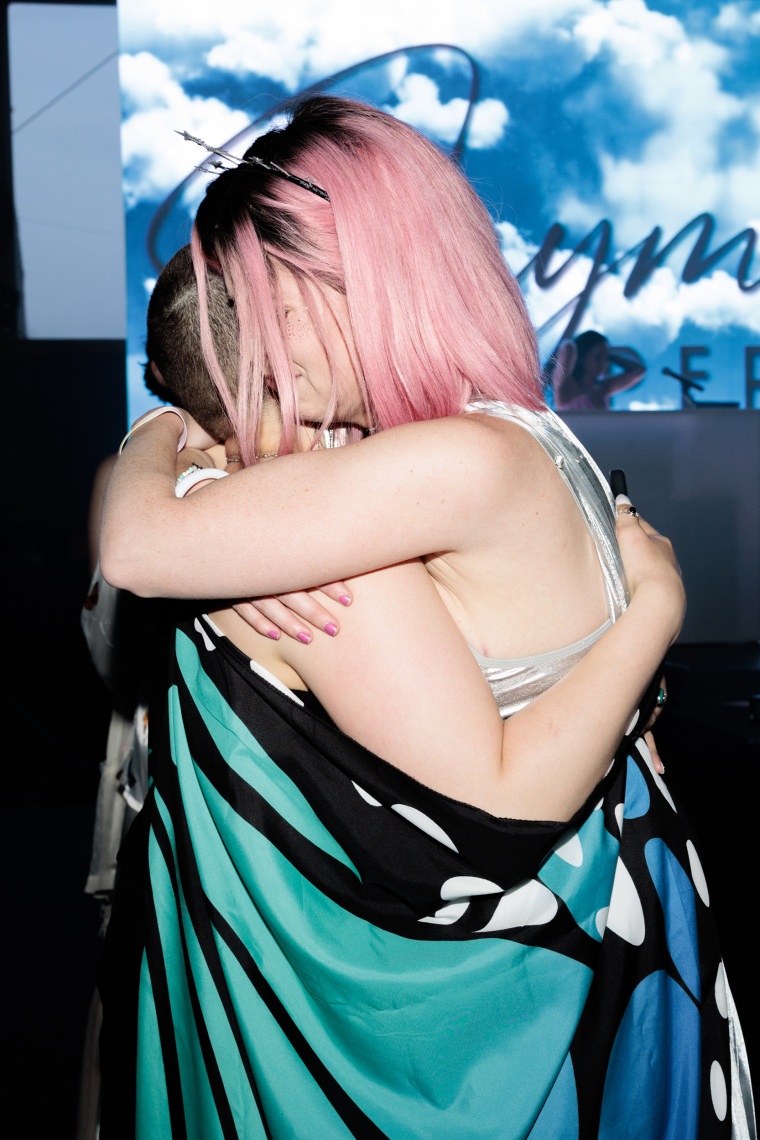 People hug during Breastival.