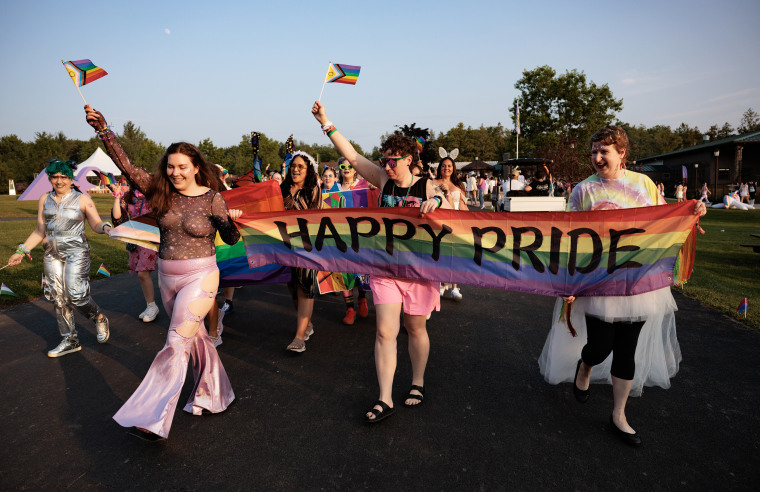 People march in the Pride Parade at Camp Breastie.
