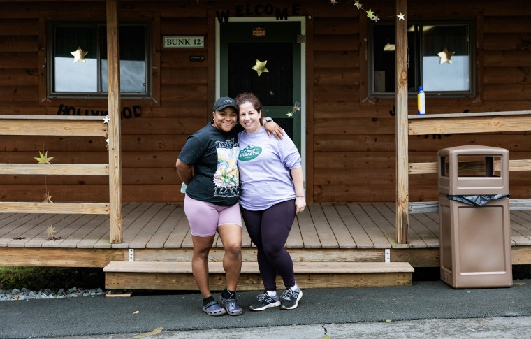Melary Cruz, 33, and Lindsey Baker, 40, pose for a portrait at Camp Breastie.