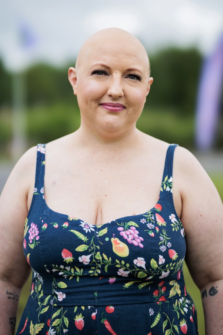 Liz Rainey, 40, poses for a portrait at Camp Breastie.