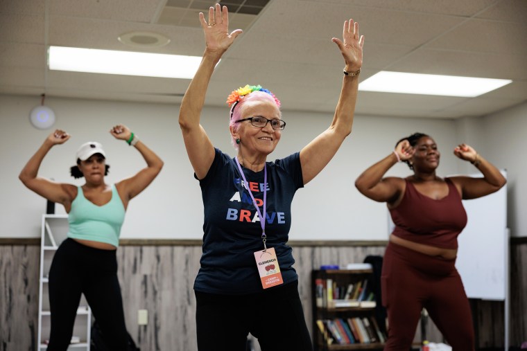 People dance during a movement and mindfulness Salsa class.