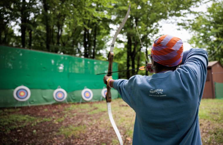 Jazmin Hidalgo prepares to shoot an arrow at a target during archery.