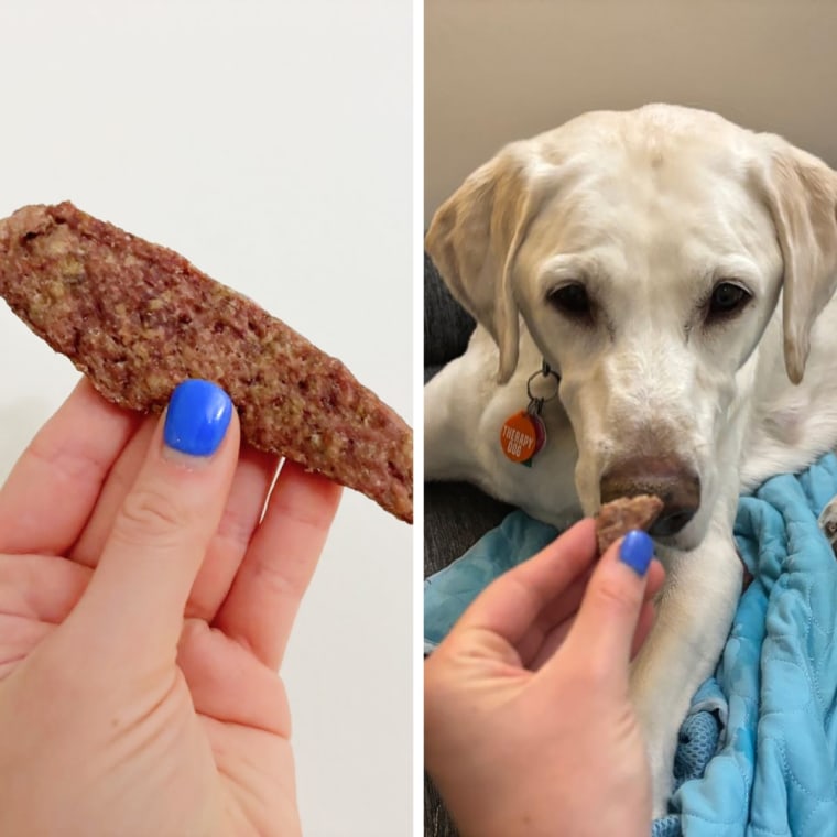 A hand folding a Full Moon Essential Beef Tender dog treat, left, and a yellow lab getting a piece of the treat, right.