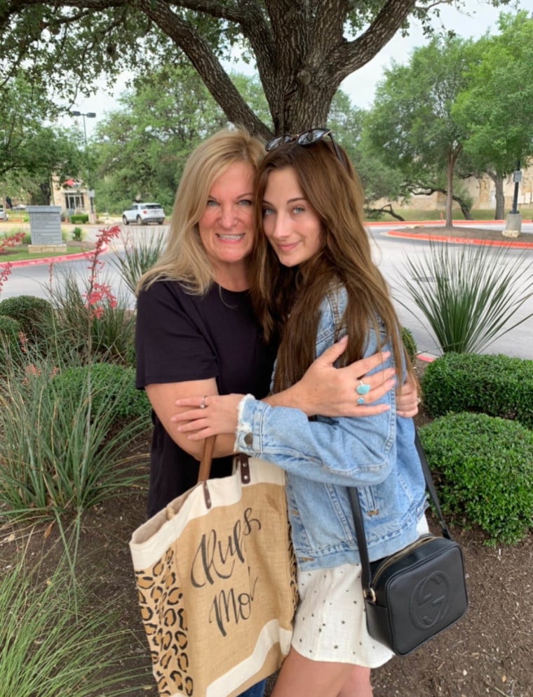 Kelly Lindner (left), with her daughter, says women feel "safe" talking about menopause at work.
