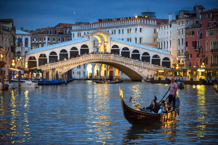 Rialto bridge gondola tourists rialto bridge grand canal venice italy dusk
