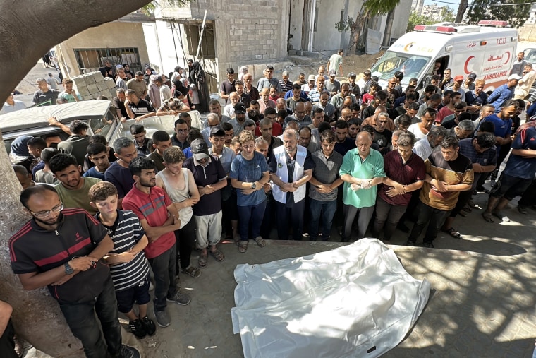 Mourners gather outside Al-Shifa medical complex Wednesday.