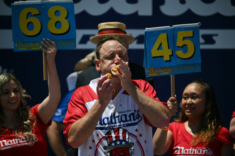 Joey Chestnut eating hot dogs