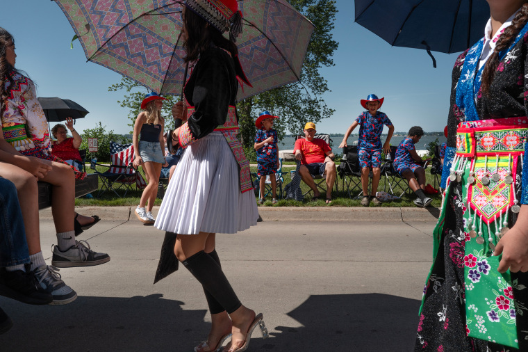 Residents gather to watch as the Independence Day parade passes by Storm Lake, Iowa, on Friday. The town is the state's most ethnically diverse, with about 40% of the population claiming Hispanic heritage and about 15% Asian heritage, and more than 30% foreign born.
