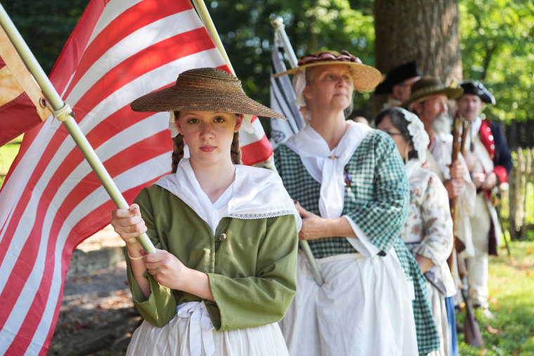 Vivian LaFountain and other members of the Clinch Bend chapter of Daughters of the American Revolution during the Museum of Appalachia's annual Independence Day celebration and anvil shoot in Norris, Tenn., on Friday.