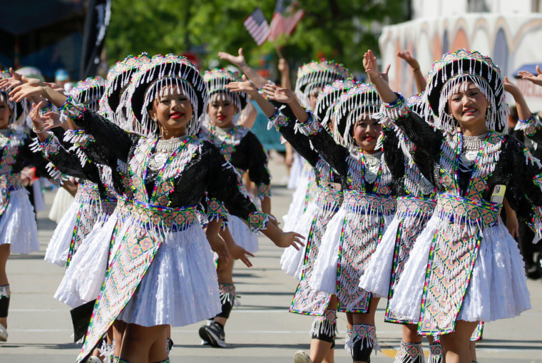 Sheboygan Hmong dancers performing in traditional costumes.