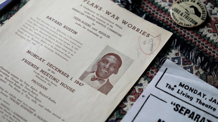 Documents are laid out on a table